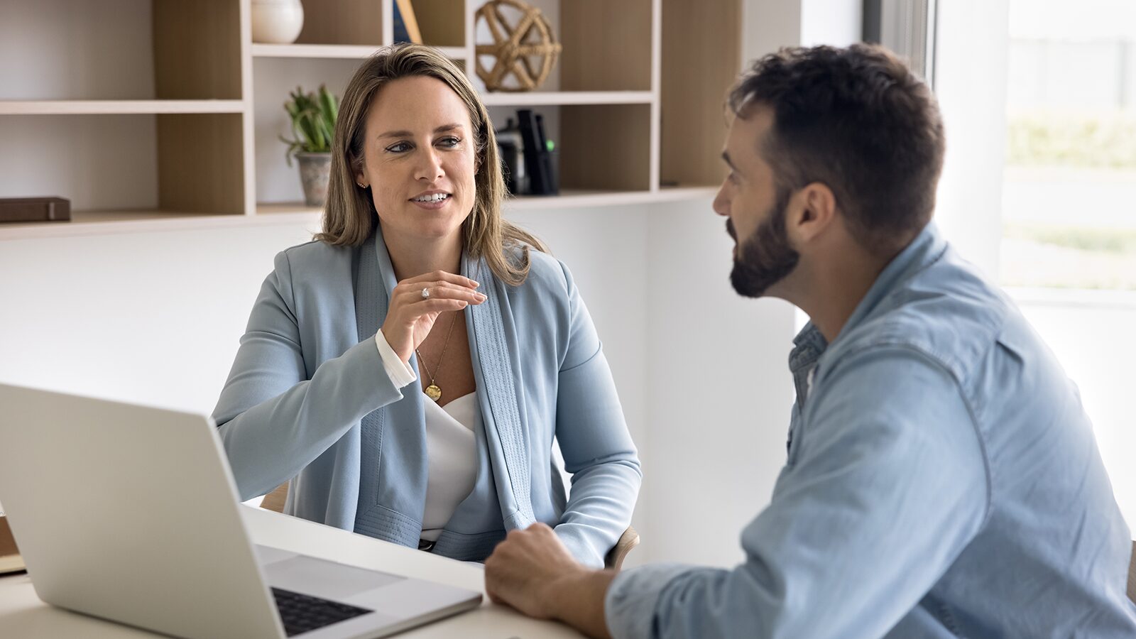 Business consultant discussing technology needs with a client