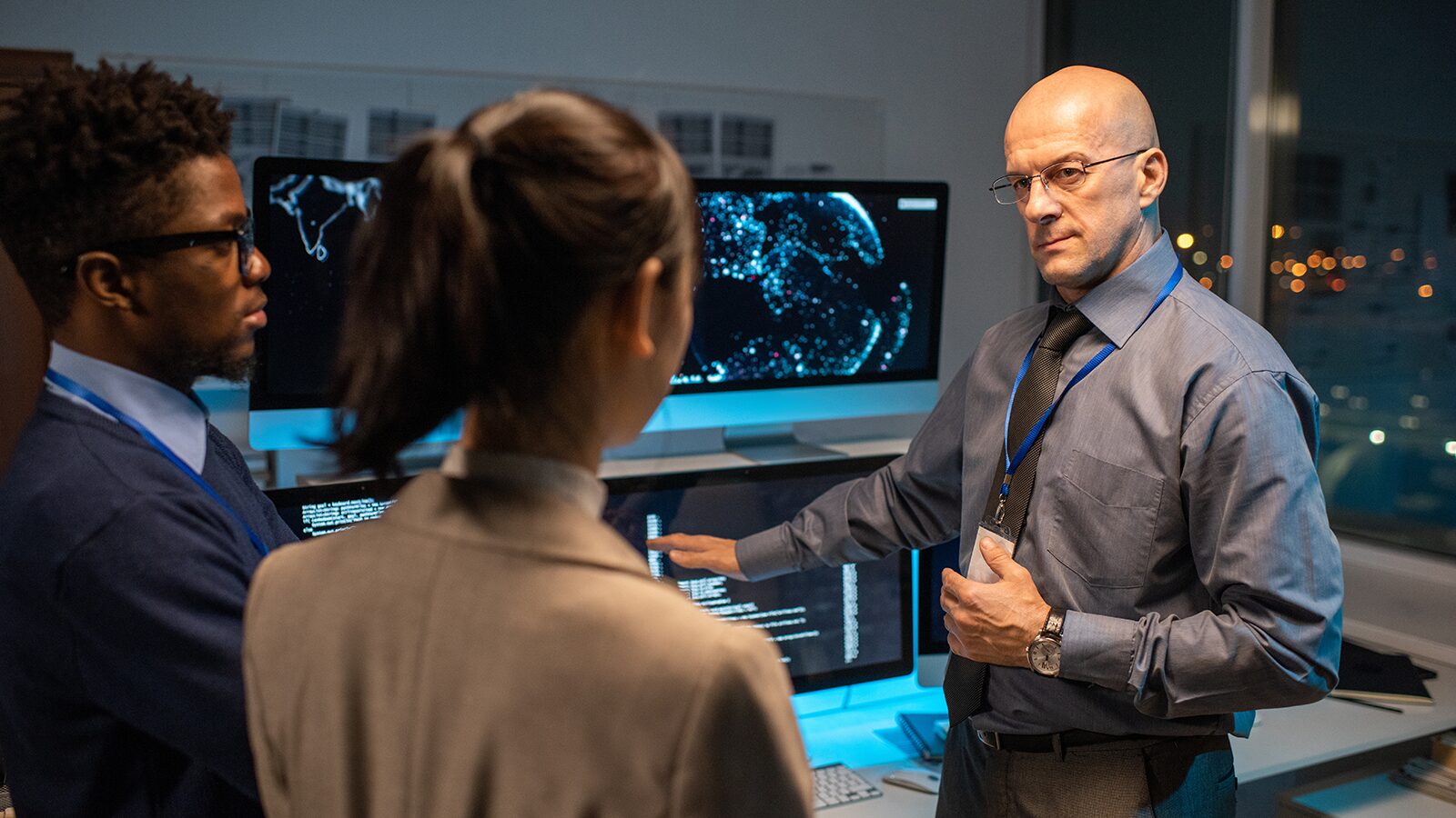 IT consultant leading a technical review with colleagues